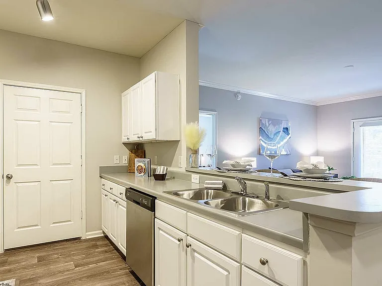 Experience the seamless blend of a modern kitchen and cozy living space.