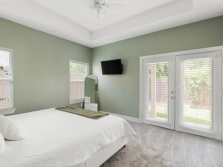 Bedroom 3: Spacious private bedroom with backyard access _ $1,100/month.