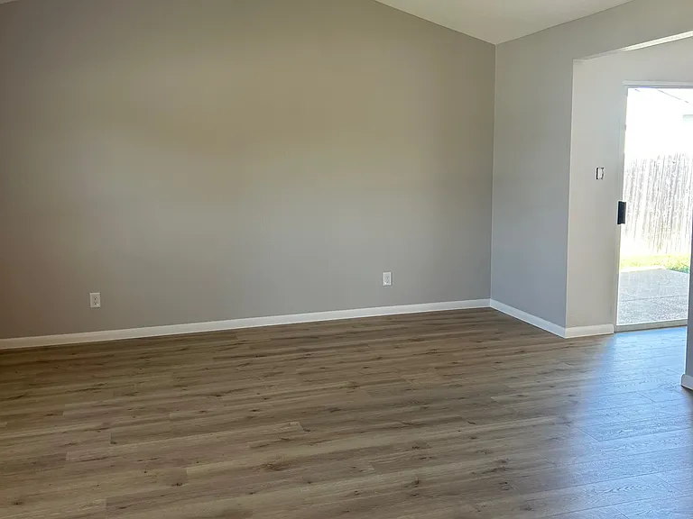 Living area leading to kitchen and eating area