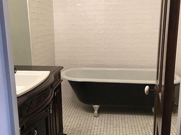 Bathroom with Clawfoot Tub and Vanity