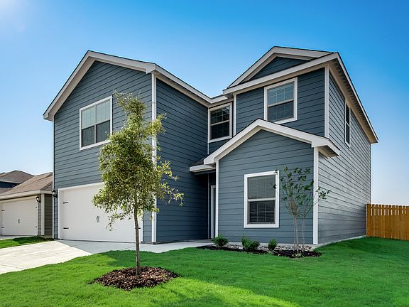 This home has incredible curb appeal and professional front yard landscaping.