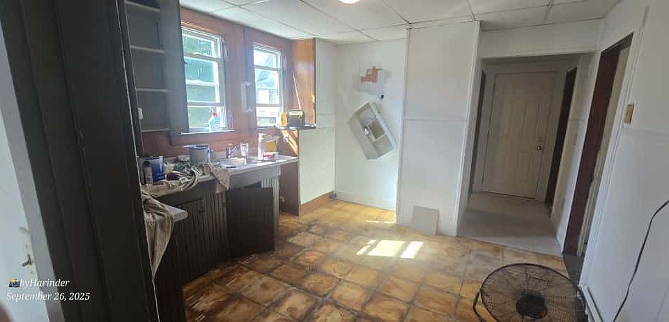 kitchen leading to bathroom and bedroom