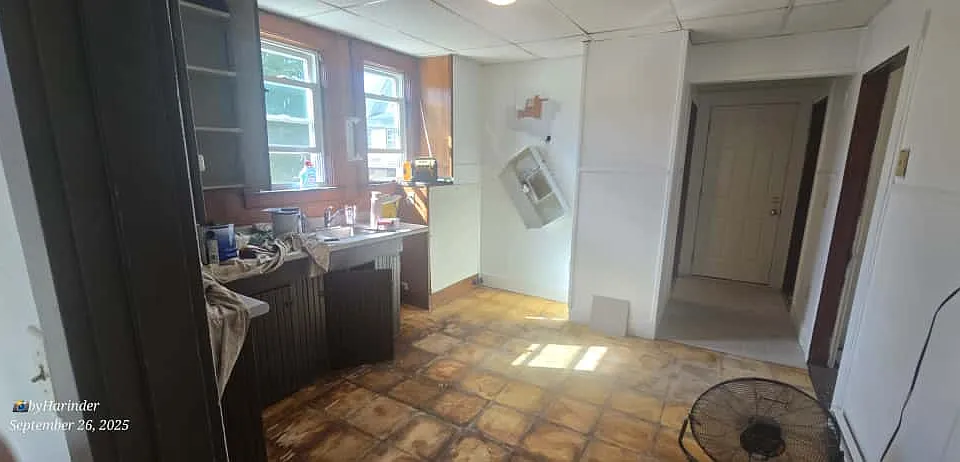 kitchen leading to bathroom and bedroom