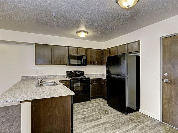 Kitchen with Fridge, range, and microwave