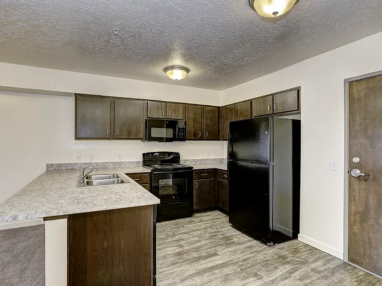 Kitchen with Fridge, range, and microwave