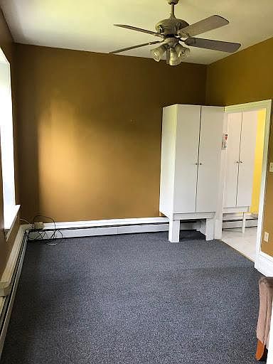 This is the living room looking in from the hallway to the bathroom/bedroom area. that doorway off to the far left is to the kitchen. The wall color is more antique gold but looks leathery in this shot. About 12x15