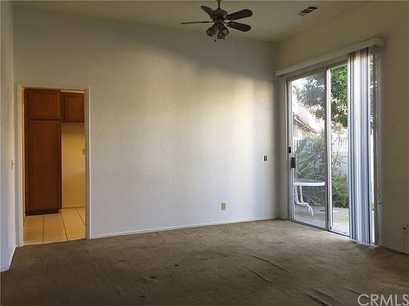 Formal living room as part of the large living room. Pocket door leads to large kitchen.