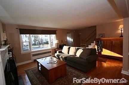 Living Room : LR has restored fireplace, huge picture window and a foyer with a deep closet.