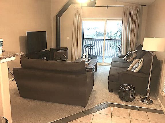 Family room with balcony access and gas fireplace