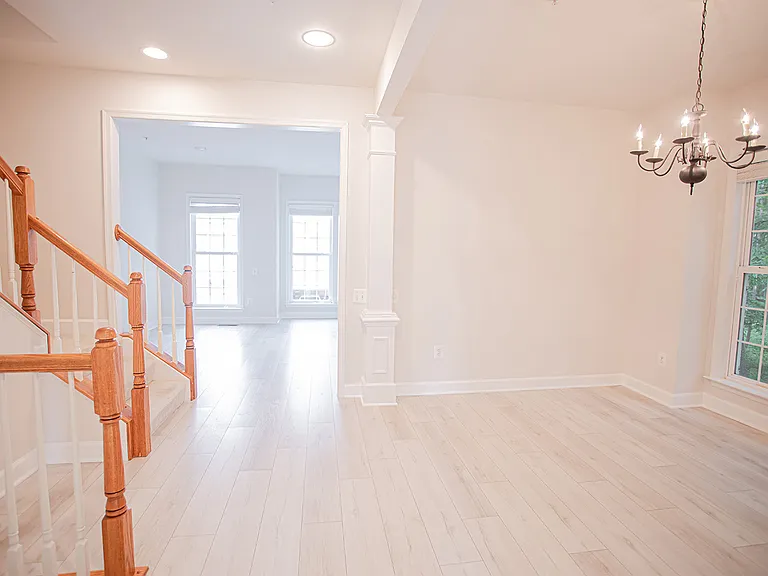 Walking through the dining room to the sun filled kitchen and breakfast area