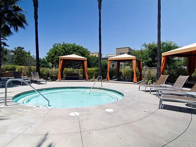 resort style hot tub, with private cabanas around