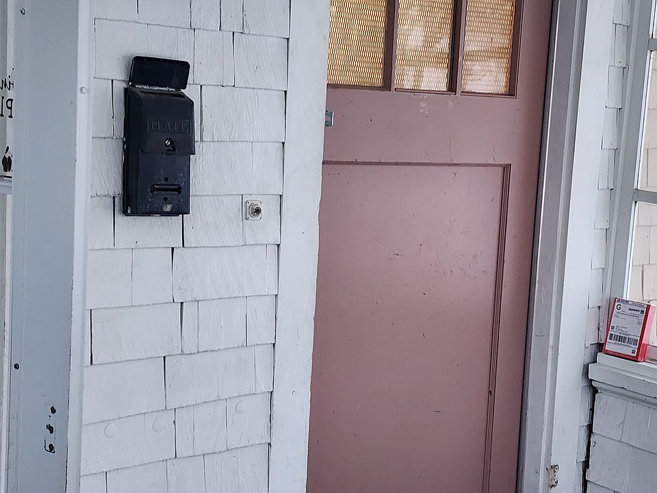 Separate entrance off a porch shared with main floor tenant.