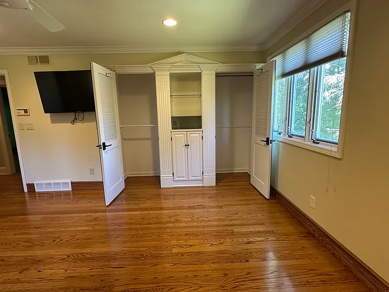 Double closets with built-in storage inside bedroom 4.