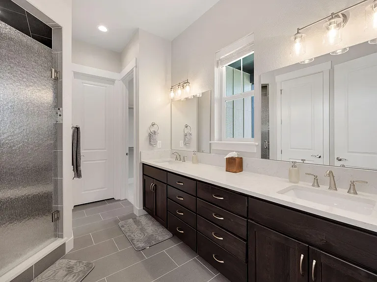 Huge Master bathroom with walk-in shower (dual shower heads and sitting bench}
Dual sinks