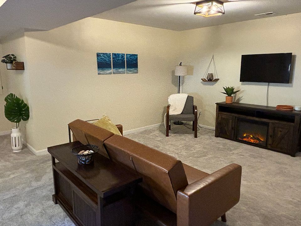 Fully furnished living area with electric fireplace included
