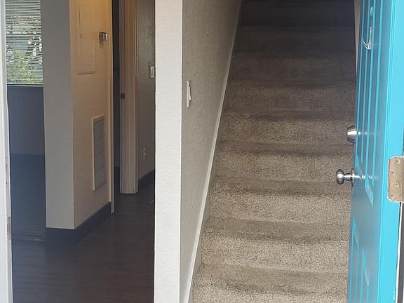 Hallway to first floor, stairs to second floor.