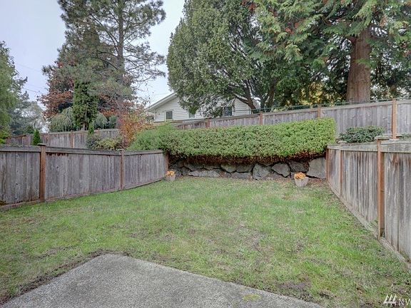 The fenced back yard and patio area.