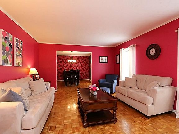 Formal Living Room: wood parquet flooring and crown moulding.