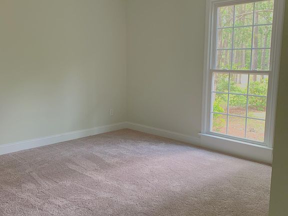 Bedroom One! New flooring and new paint throughout the home Ceiling fans in all bedrooms.