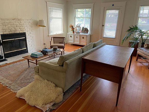 Living room with wood burning fireplace