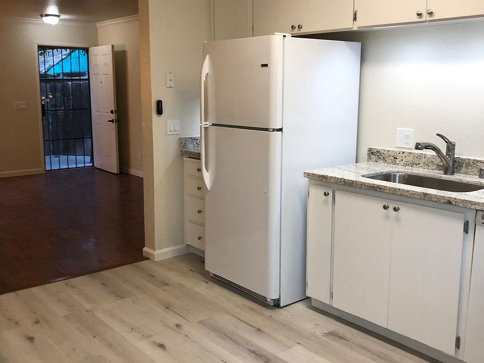 Open floor plan from kitchen to living room & security screen door in addition to the front door.