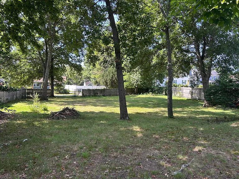 Large fenced in back yard with gate for additional access from parallel street.