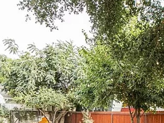 Backyard with fire pit and chicken coop