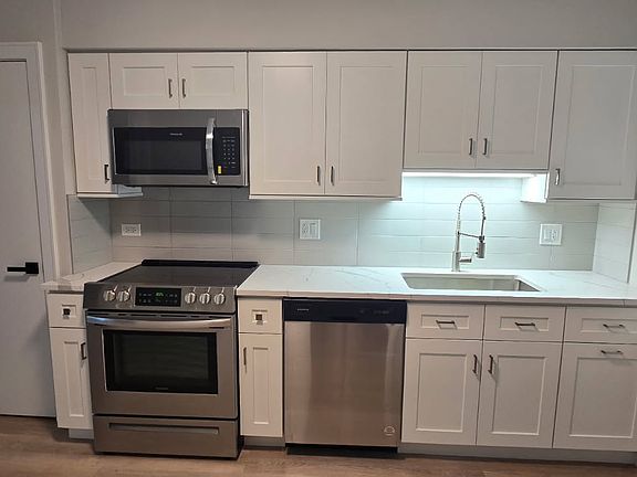 Brand new kitchen with new cabinets ,new sink, new faucet, quartz countertop