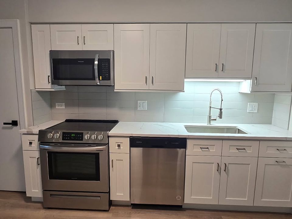 Brand new kitchen with new cabinets ,new sink, new faucet, quartz countertop