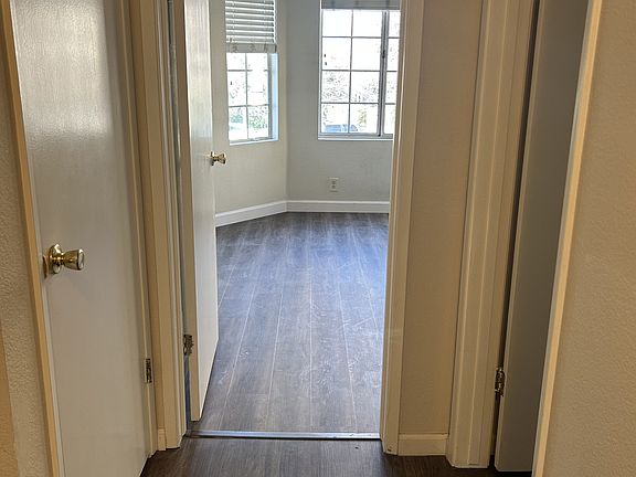 Hallway looking to front bedroom and bathroom on the right