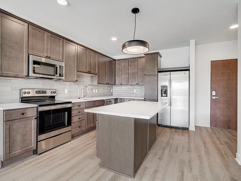 Spacious kitchens with sleek cabinetry and stainless-steel appliances offer style and functionality.