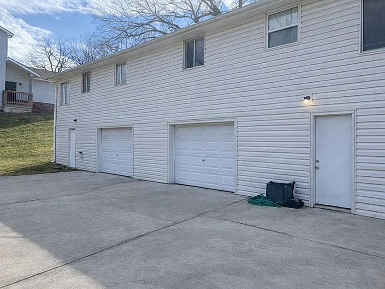 Attached 1-car garage with opener and additional driveway and street parking available.