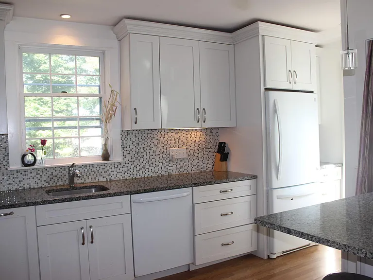 Another angle of Kitchen. there is additional entrance to kitchen from drive way.