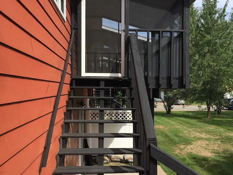 Entrance to screened in balcony from the back
