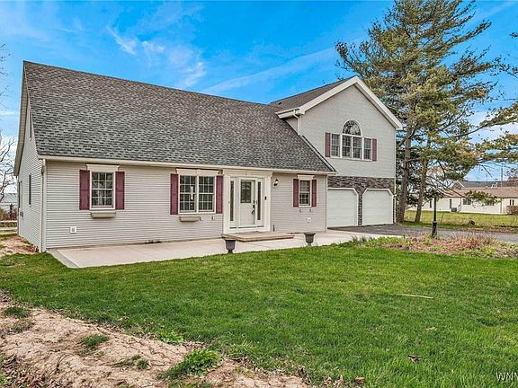 Large concrete pad in front of house