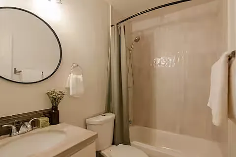 Bathroom 1
Modern full bathroom featuring a sleek vanity, large mirror, walk-in shower, and a bathtub. Neutral tones, clean lines, and bright lighting create a fresh, spa-like atmosphere.