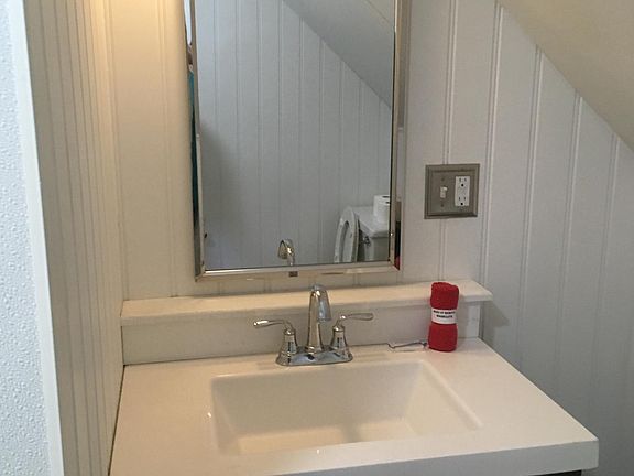 The shower in the bathroom has great water pressure with plenty of hot water.