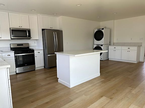 View of great room: laundry and side board serving station, folding station, coffee bar, wine bar take your pick!