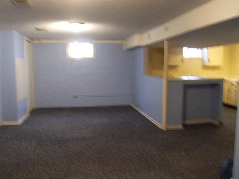 This family room playroom in this basement could use as a mother in law suite.
