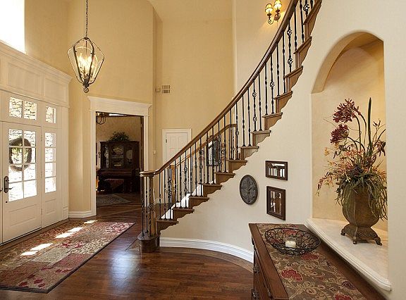 Elegant entry with sweeping staircase