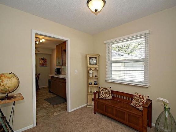 Charming and inviting entryway with updated lighting, flooring and fresh paint.