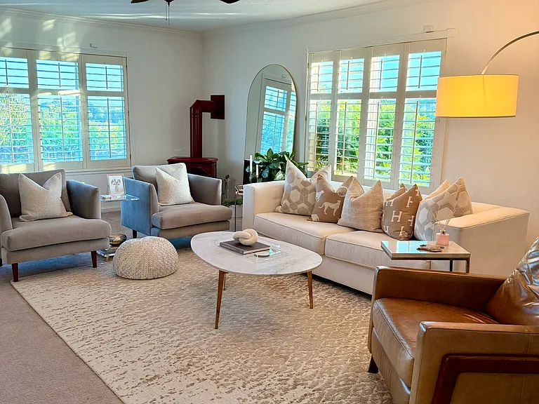 Livingroom with Gas fireplace. Shutters cover all windows throughout.