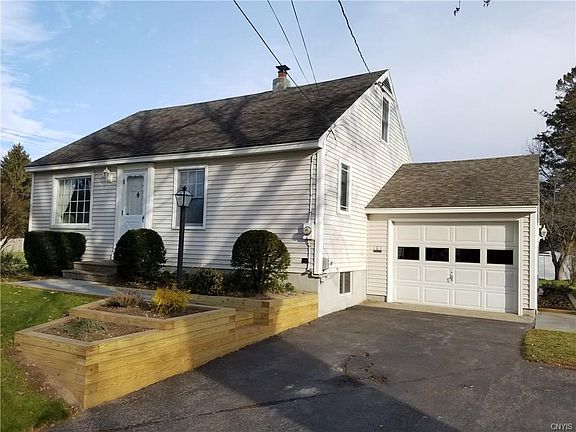 New retaining wall, front and side walkways.