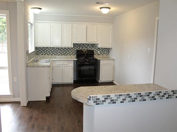 LOOK AT THE NEWLY REMODELED KITCHEN