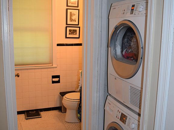 Bathroom with adjacent laundry area