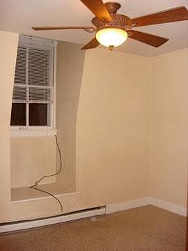 Bedroom with carpet, remote ceiling fan.