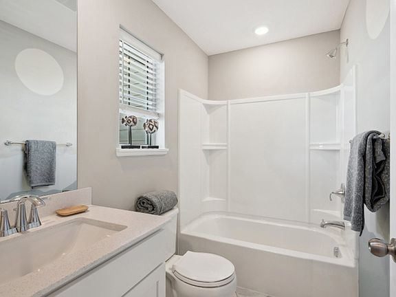 Bathroom 2:
This full bathroom near the secondary bedrooms on the second floor can be accessed from the loft, providing convenience for the whole family.