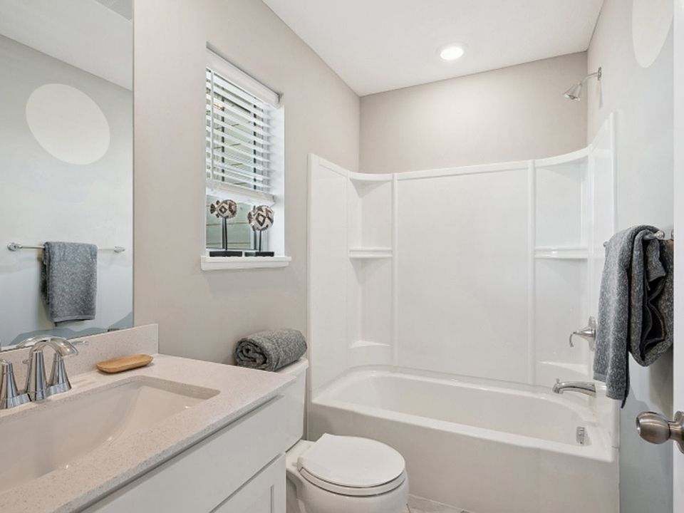 Bathroom 2:
This full bathroom near the secondary bedrooms on the second floor can be accessed from the loft, providing convenience for the whole family.
