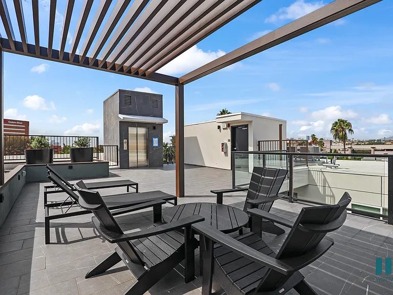 Rooftop Terrace with Pergola and Seating Area