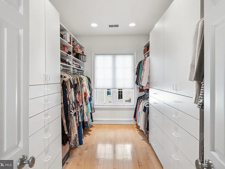 Stylish walk-in closet with natural light.
